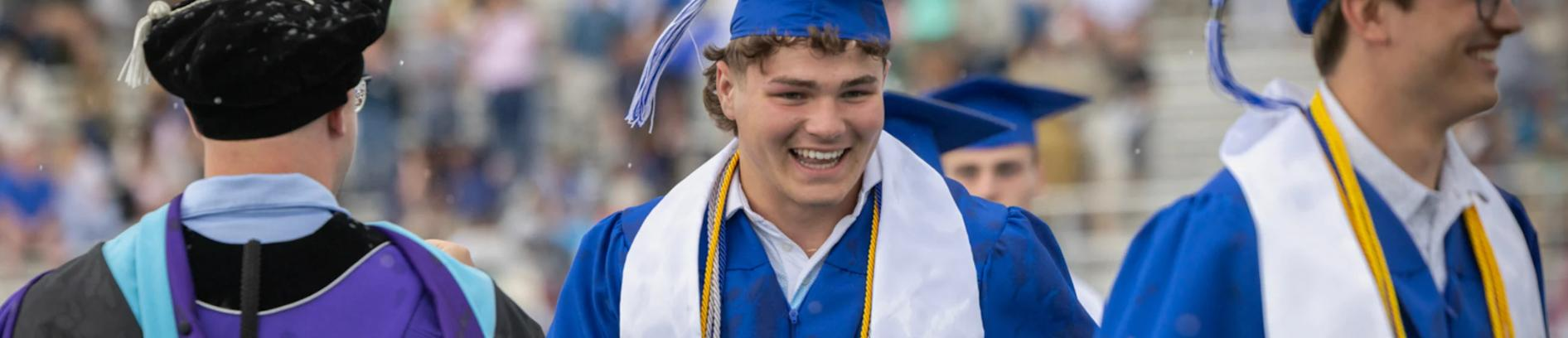 Graduating high school students celebrating at commencement ceremony