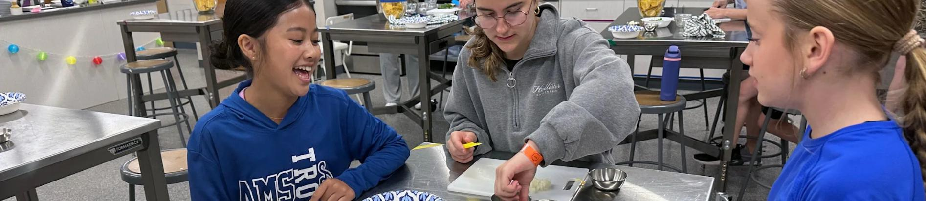 Students collaborating during a culinary or science lab session