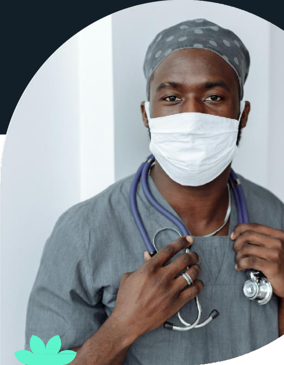 Doctor wearing scrub cap, face mask, and stethoscope around neck