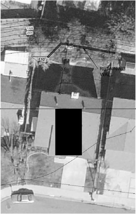 Aerial photo showing a house and property with hand-drawn lines for a proposed retaining wall. Labeled as UNACCEPTABLE.