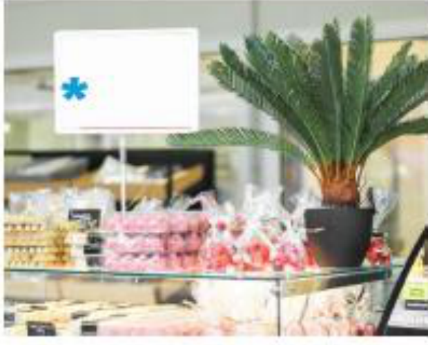 Example of a small notification placard displayed in a deli or bakery display case