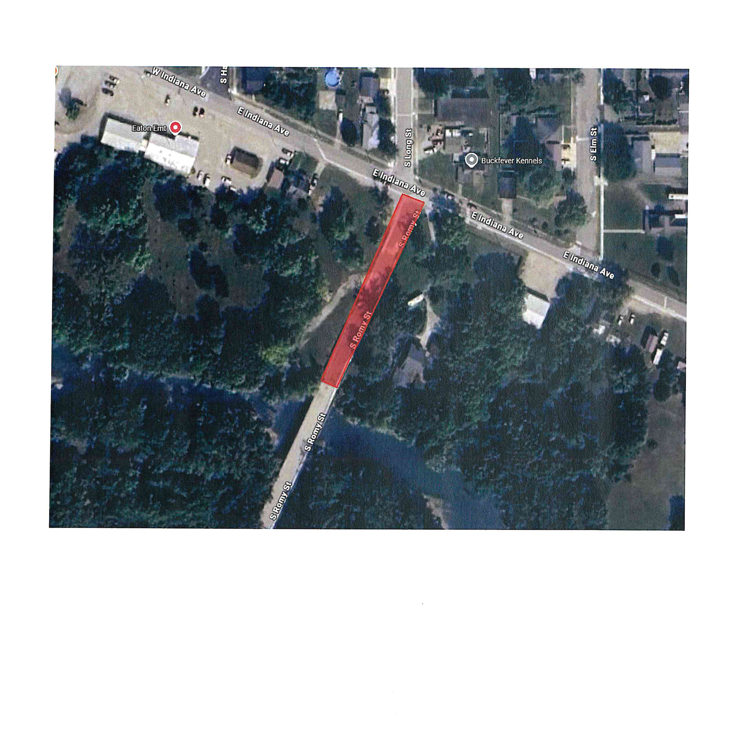 Aerial satellite map highlighting S Romy St in red, with intersecting streets E Indiana Ave, W Indiana Ave, S Long St, and S Elm St, alongside landmarks Eaton Emt and Buckfever Kennels.