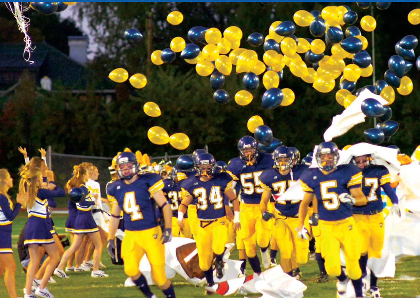 Oakwood High School football players with balloons