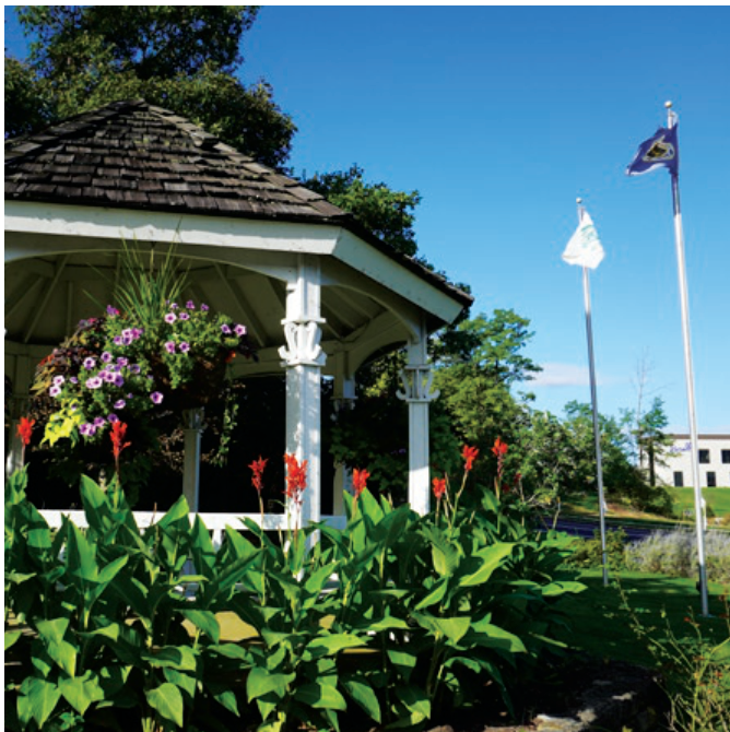 Oakwood park gazebo surrounded by flowers