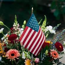 Floral arrangement with an American flag