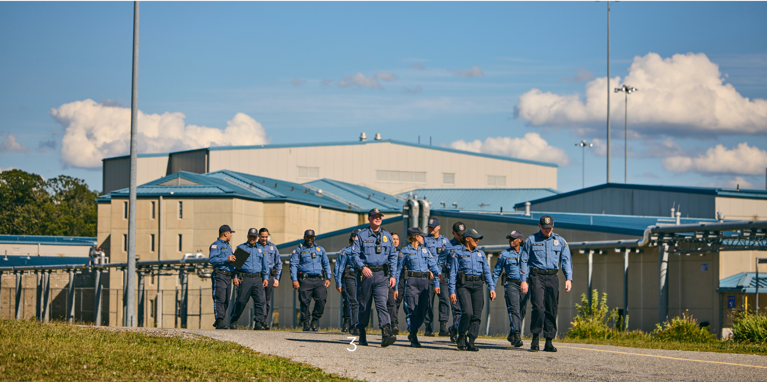Group of NJDOC correctional police officers walking together outdoors at a facility
