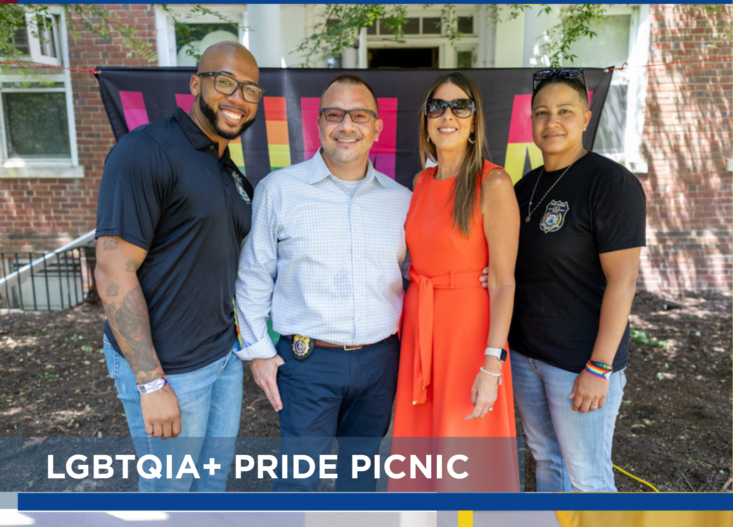 Four attendees posing together at the LGBTQIA+ Pride Picnic