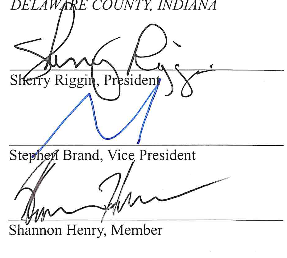 Handwritten signatures of Commissioners Sherry Riggin, President; Stephen Brand, Vice President; and Shannon Henry, Member