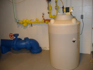 Chlorine Pump and storage tank at Springhouse