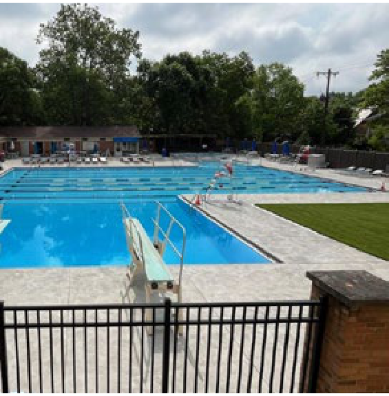 Gardner Pool diving board and swimming lanes viewed through fence