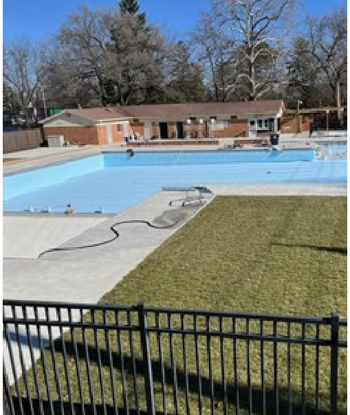 Gardner Pool showing light blue pool liner installation and surrounding fencing