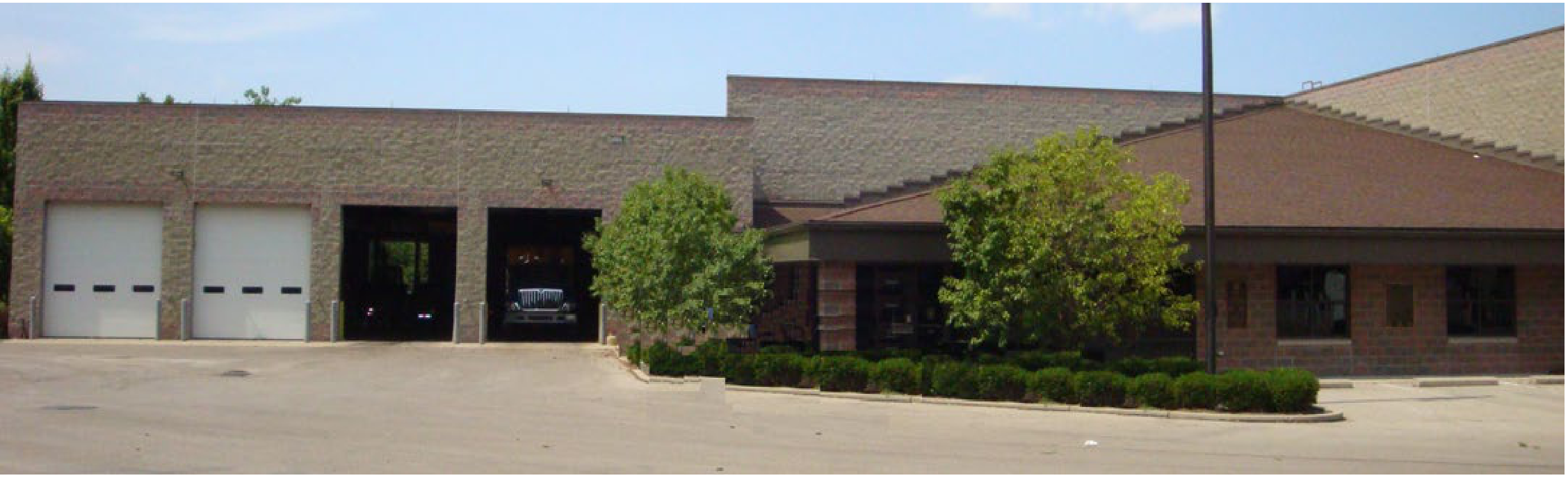 City of Oakwood Public Works Department facility showing garage bays and office building exterior