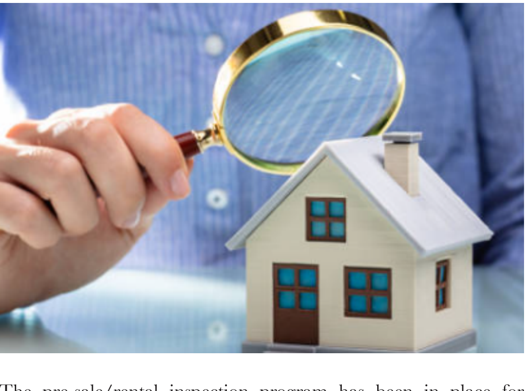 Magnifying glass inspecting a miniature model house