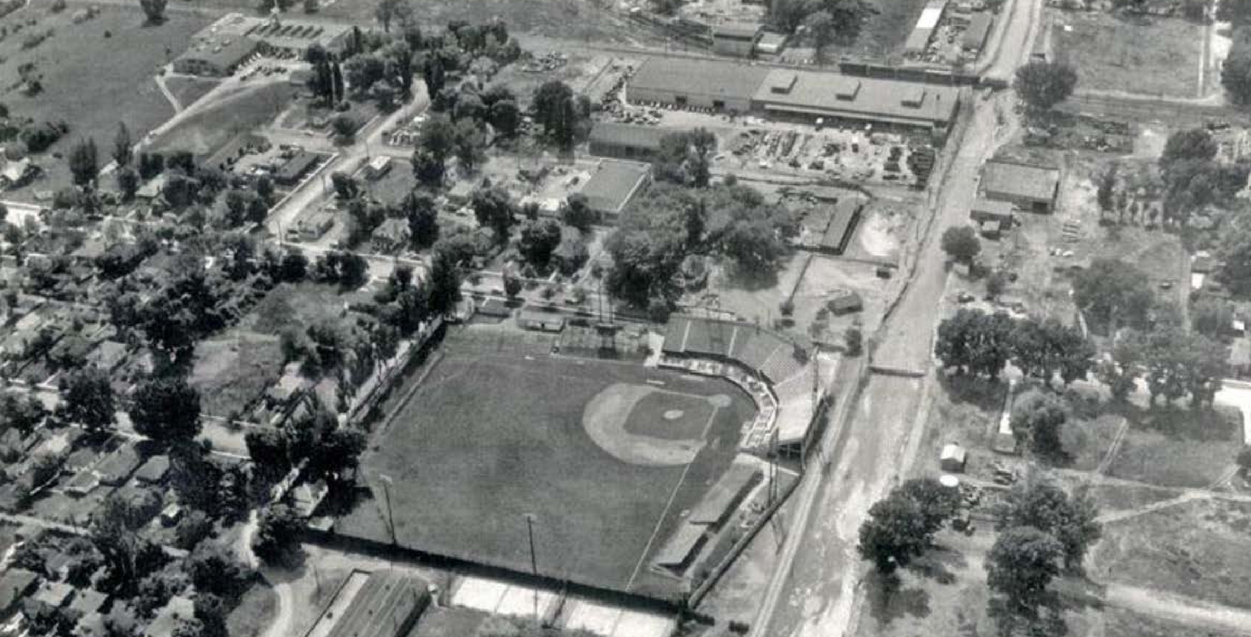 Black-and-white aerial photograph of Derks Field baseball stadium and the surrounding neighborhood in 1952.
