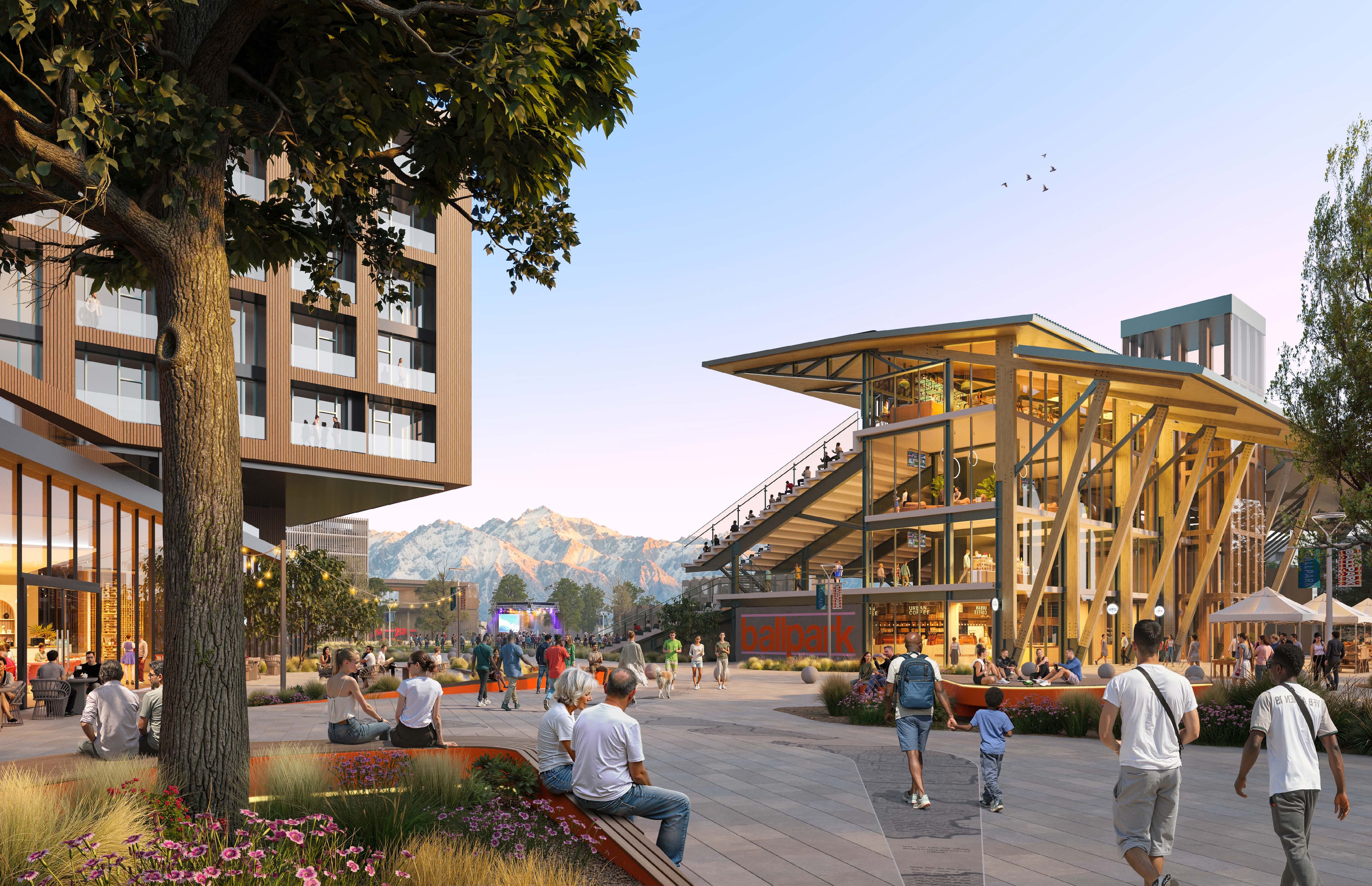 Illustrated public plaza at a revitalized Ballpark destination, with a large shade tree, buildings, mountain views, flowering planting beds, and neighbors gathering, walking, and watching a game.