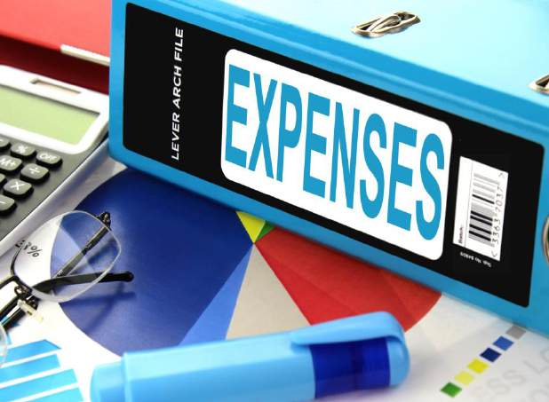 Lever arch file binder labeled Expenses with financial chart and calculator