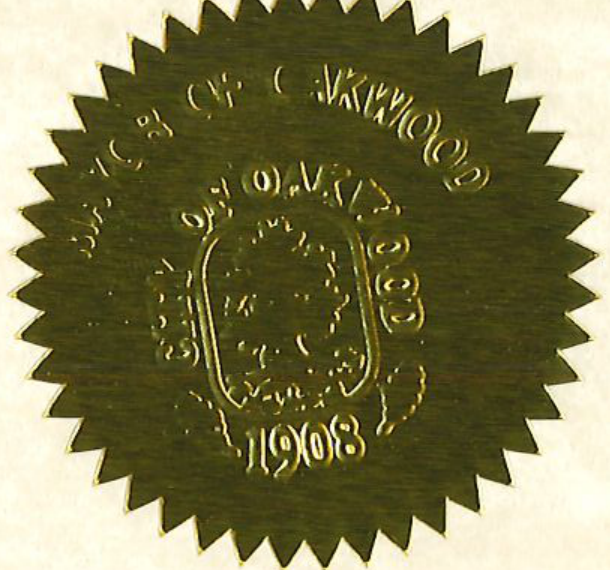 Embossed gold seal of the City of Oakwood 1908
