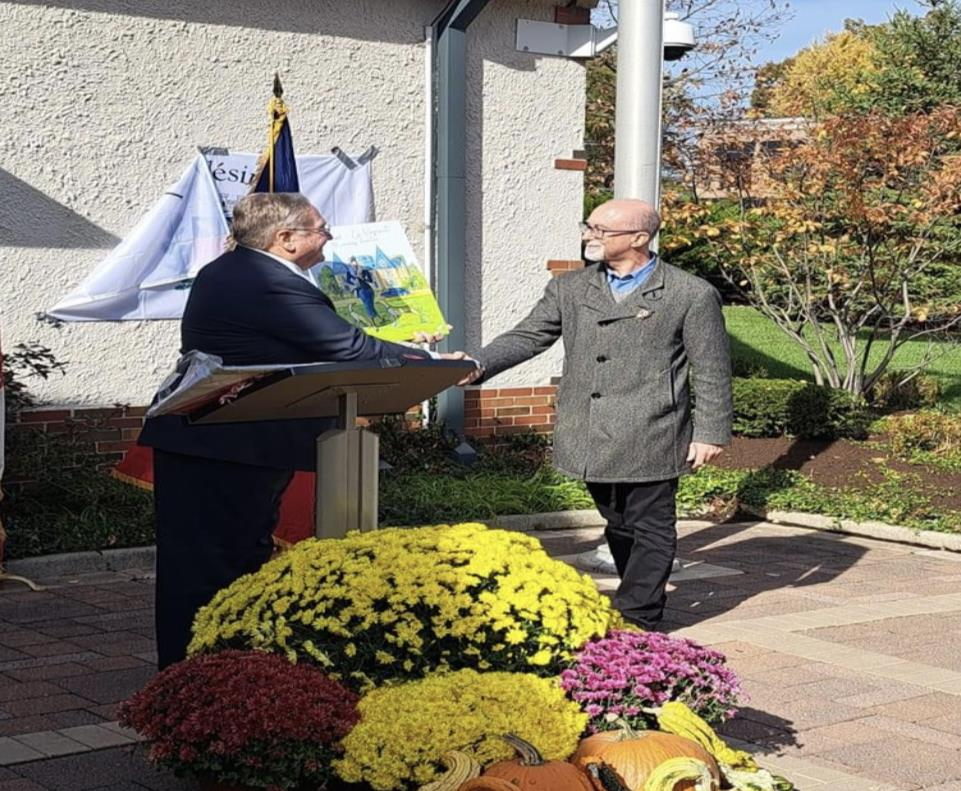 Presentation of artwork at podium during Mayor's Reception
