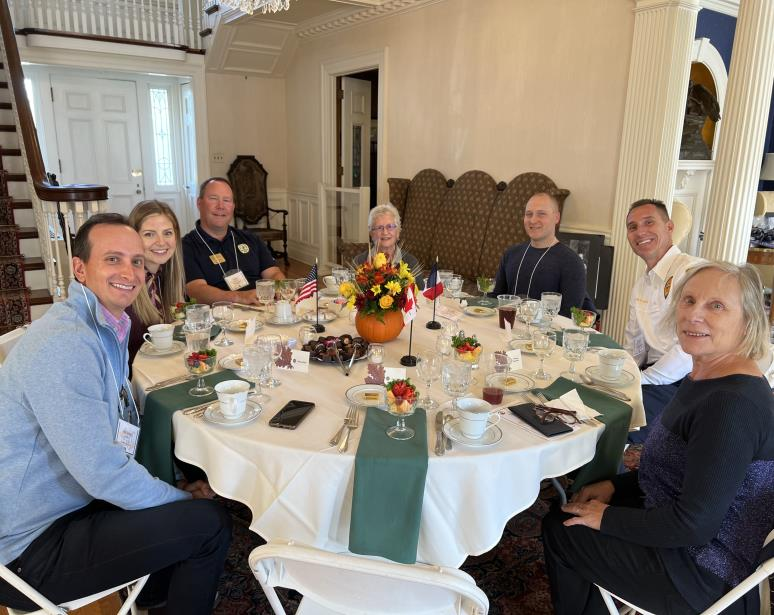 Guests seated around a decorated dining table at Hawthorn Hill