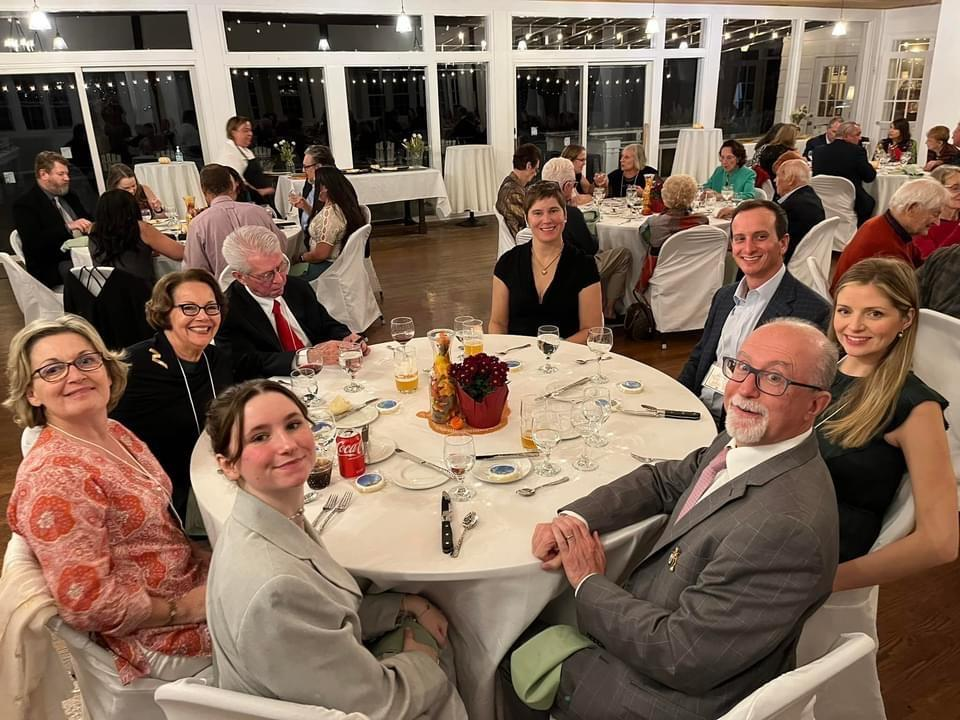 Guests seated around a dining table at the Gala Dinner