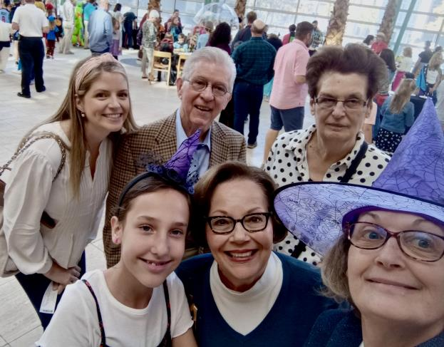 Family and friends smiling together at the PhilharMonster event