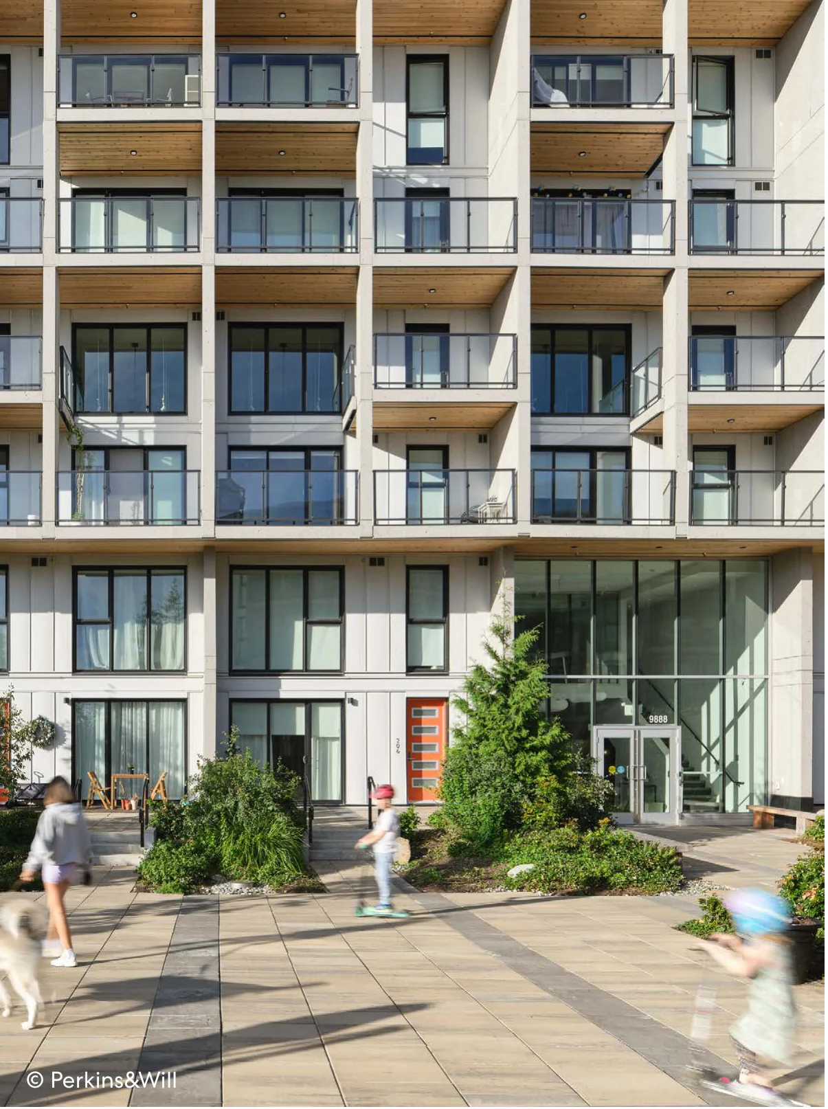 Multi-family residential building with balconies and active pedestrian courtyard