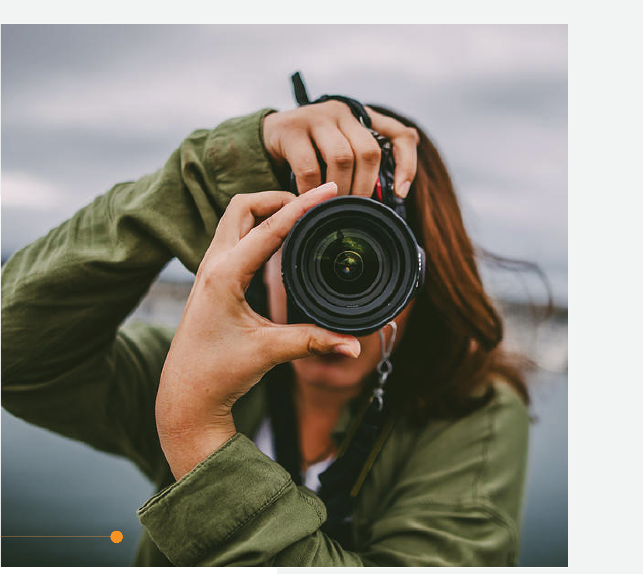 Photographer holding camera