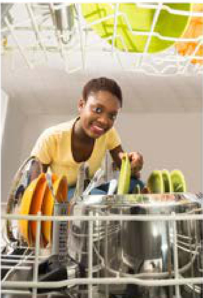 Woman loading dishes into a dishwasher