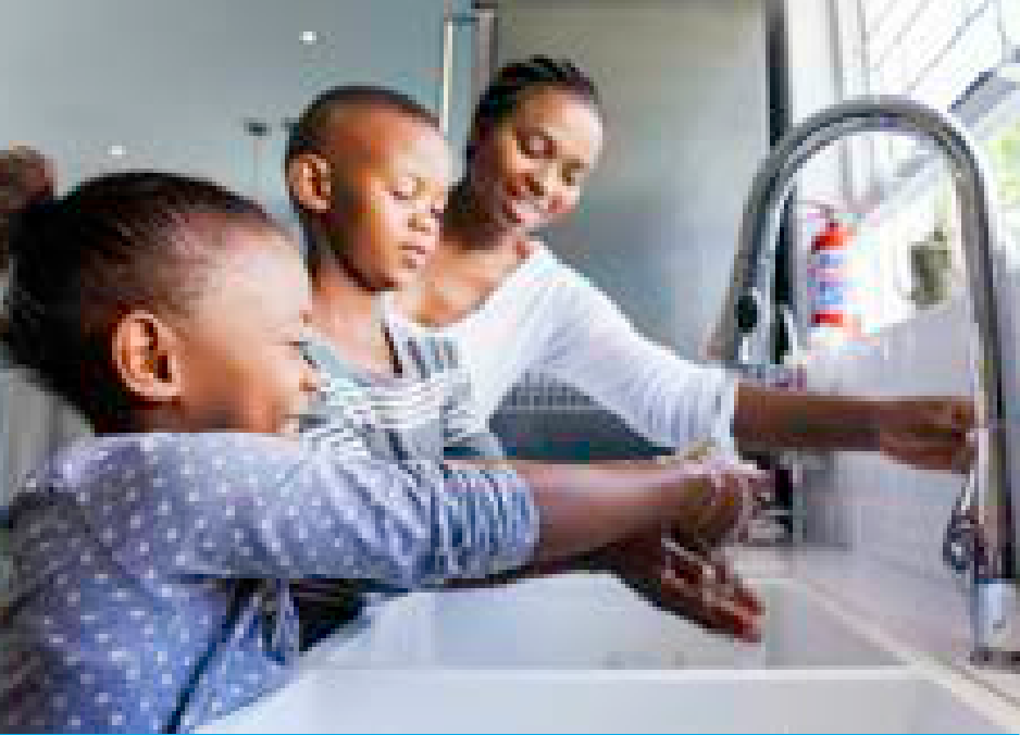 Mother and children washing hands with clean running water
