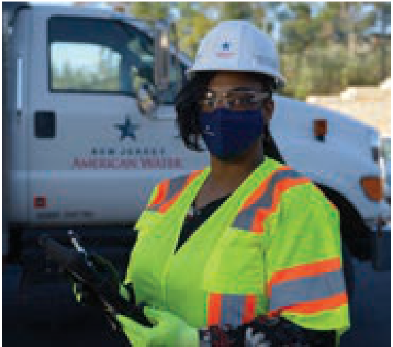 New Jersey American Water utility worker wearing safety gear in front of truck