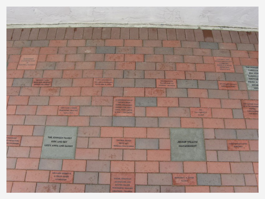 Patio paved with engraved bricks of various sizes honoring families and donors
