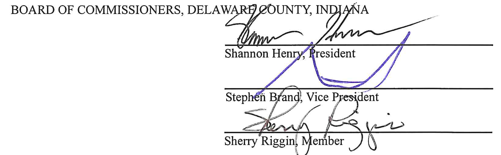 Handwritten signatures over printed signature lines for the Delaware County Board of Commissioners